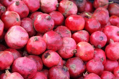 6057108-lots-of-red-pomegranates-at-a-market 6057108-lots-of-red-pomegranates-at-a-market