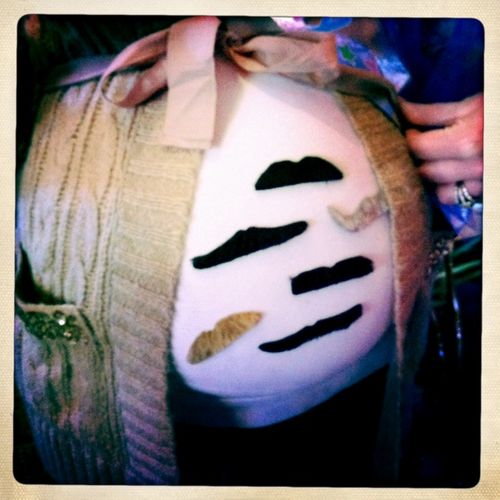 Pregnant belly with mustaches