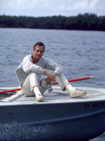 Mark-kauffman-actor-paul-newman-enjoying-a-heineken-beer-on-the-prow-of-a-boat